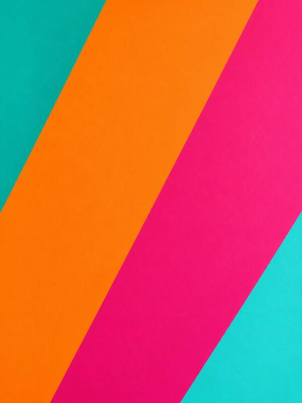 Diagonal color block stripes wall mural in turquoise, orange and pink