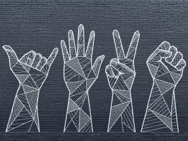 Geometric line art hand signs mural on dark brick wall
